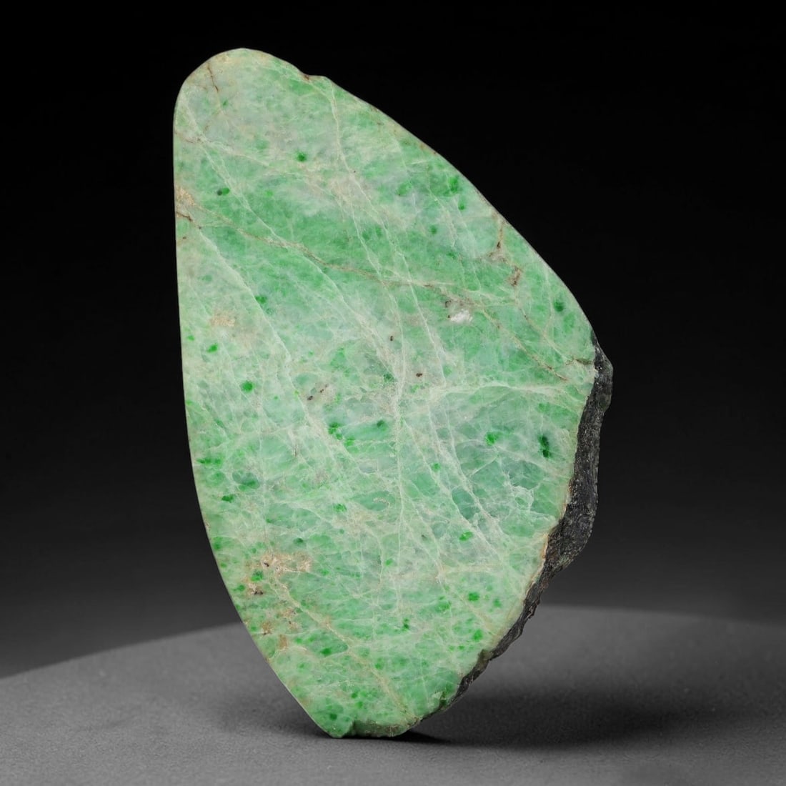480ct Natural Type A Burmese Jadeite Jade Sliced Rough, 9YK: This specimen is a sliced rough block of natural Type A Burmese jadeite jade. The interior displays natural colour zoning with visible mineral veining and crystalline patterns typical of unprocessed j