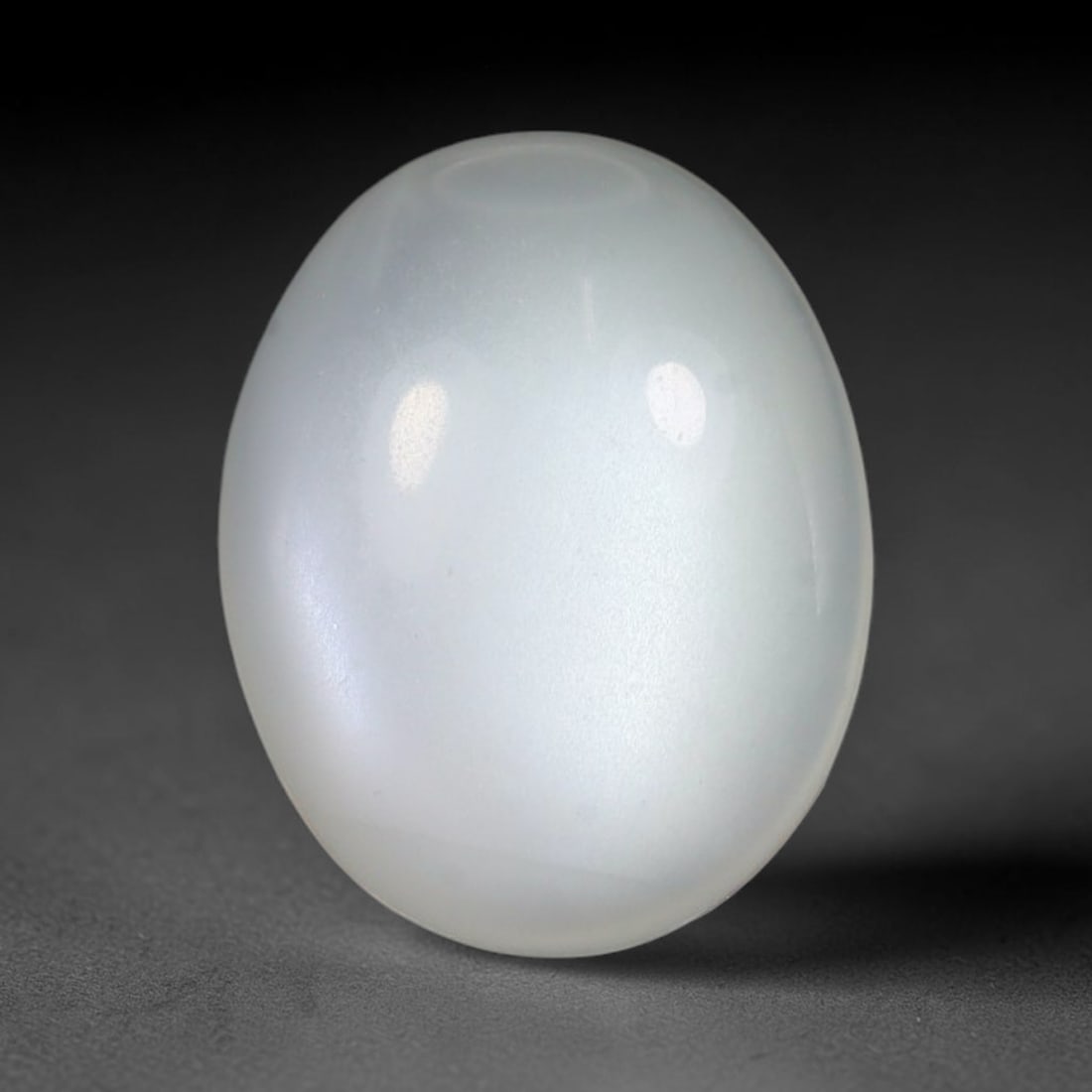 5.18 Carats Natural Ceylon White Moonstone Loose Gemstone, 46WJ: This natural Ceylon white moonstone holds dimensions of 12.9x10.1x5.1mm, a well-polished natural feldspar gemstone sourced from Ceylon's renowned moonstone mineral deposits famous for distinctive ligh