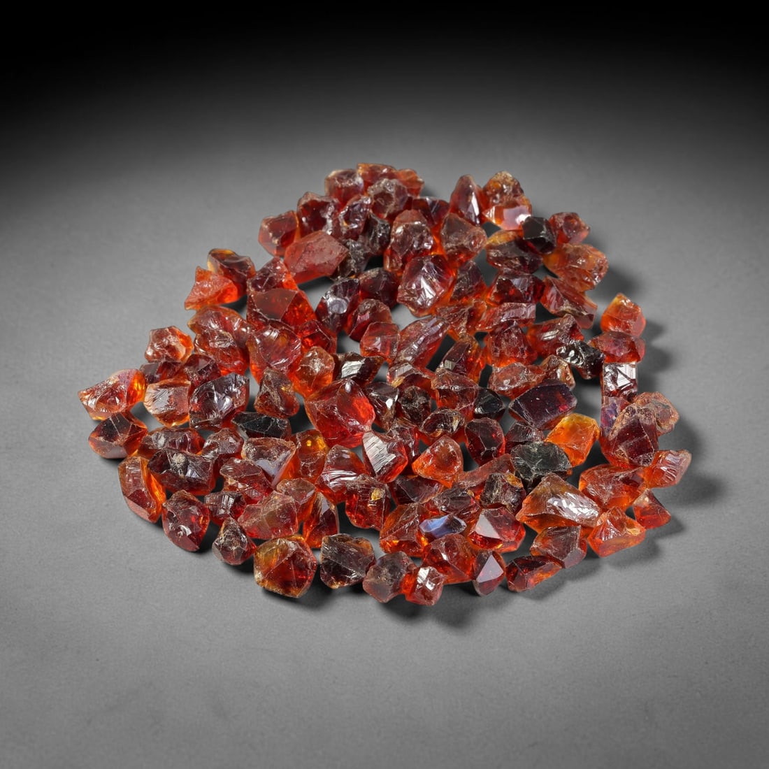 109.12 Carats Natural Garnet Rough Parcel, 75WV: This rich parcel of natural garnet rough displays deep saturated reddish-brown and fiery orange-red tones characteristic of almandine garnet, with natural translucent to semi-transparent crystalline s