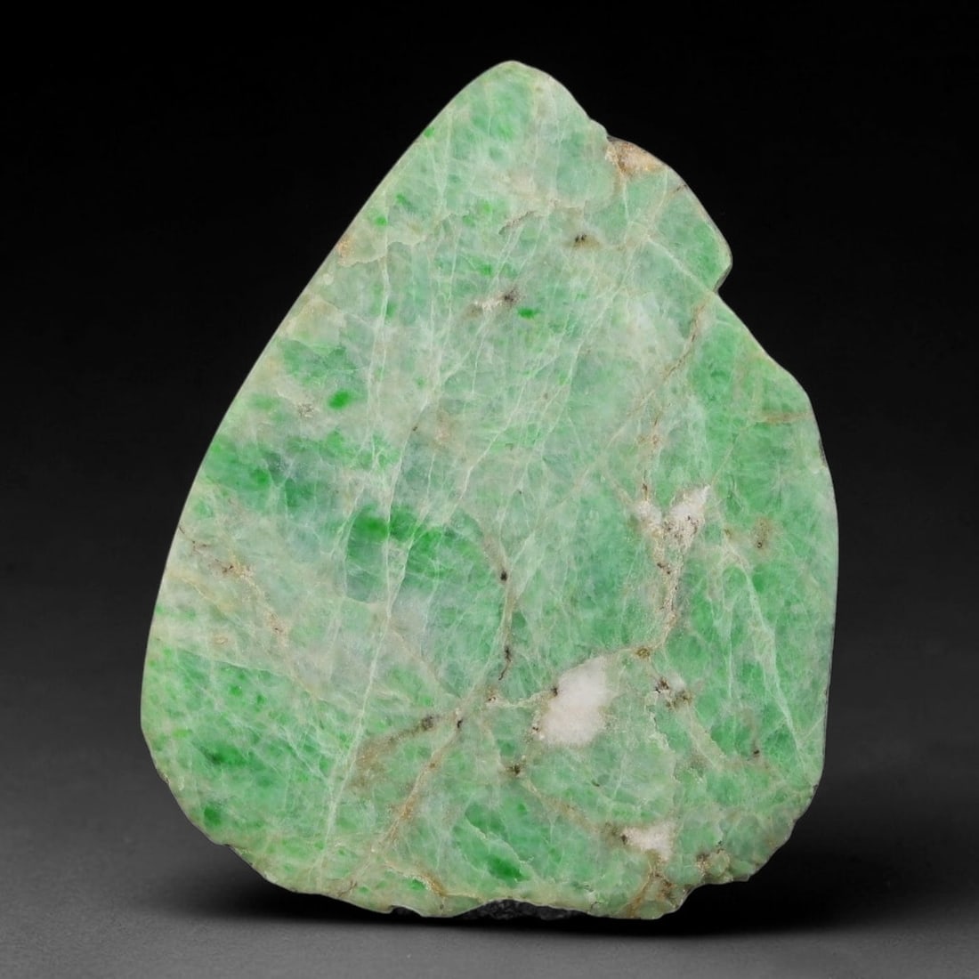 340ct Natural Type A Burmese Jadeite Jade Sliced Rough, 1YK: This specimen is a sliced rough block of natural Type A Burmese jadeite jade. The interior displays natural colour zoning with visible mineral veining and crystalline patterns typical of unprocessed j
