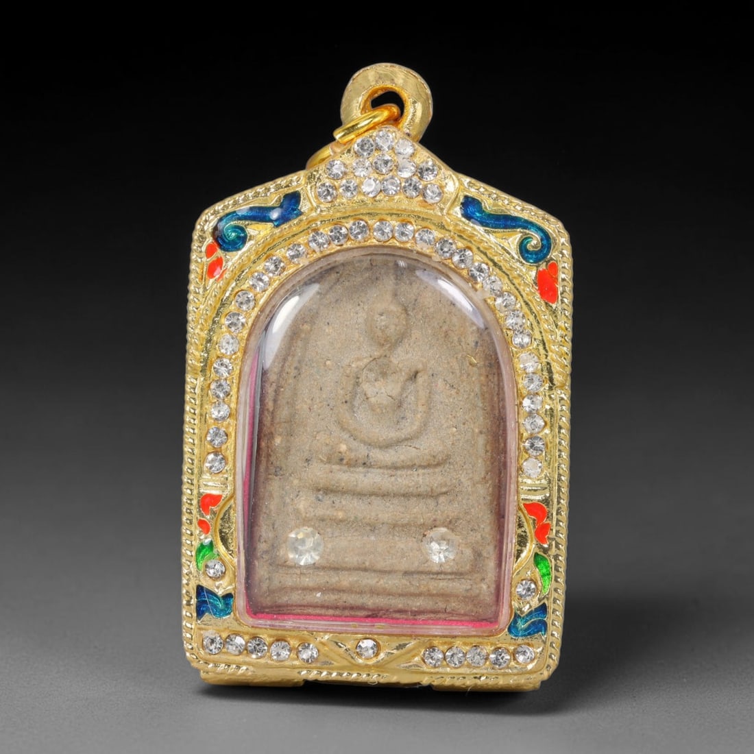 Thai Gilded Clay Metal Amulet Buddhist Votive Pendant, 61ZB: Constructed from fired clay with light gilded finishing layers, the piece uses traditional molded crafting techniques typical of Southeast Asian devotional artifacts. Its rectangular form follows stan