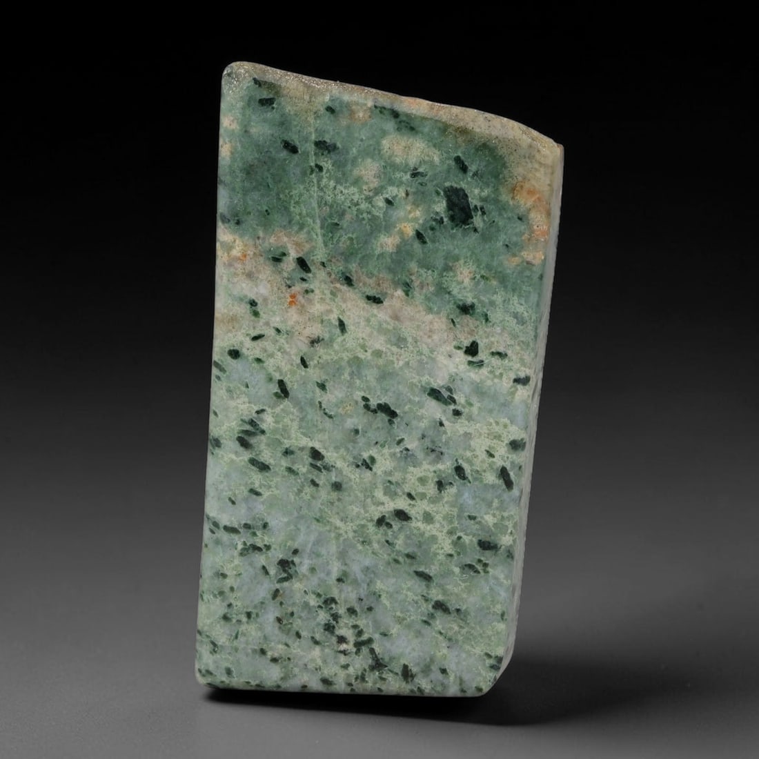 350ct Natural Type A Burmese Jadeite Jade Sliced Rough, 60YK: This specimen is a sliced rough block of natural Type A Burmese jadeite jade. The interior displays natural colour zoning with visible mineral veining and crystalline patterns typical of unprocessed j
