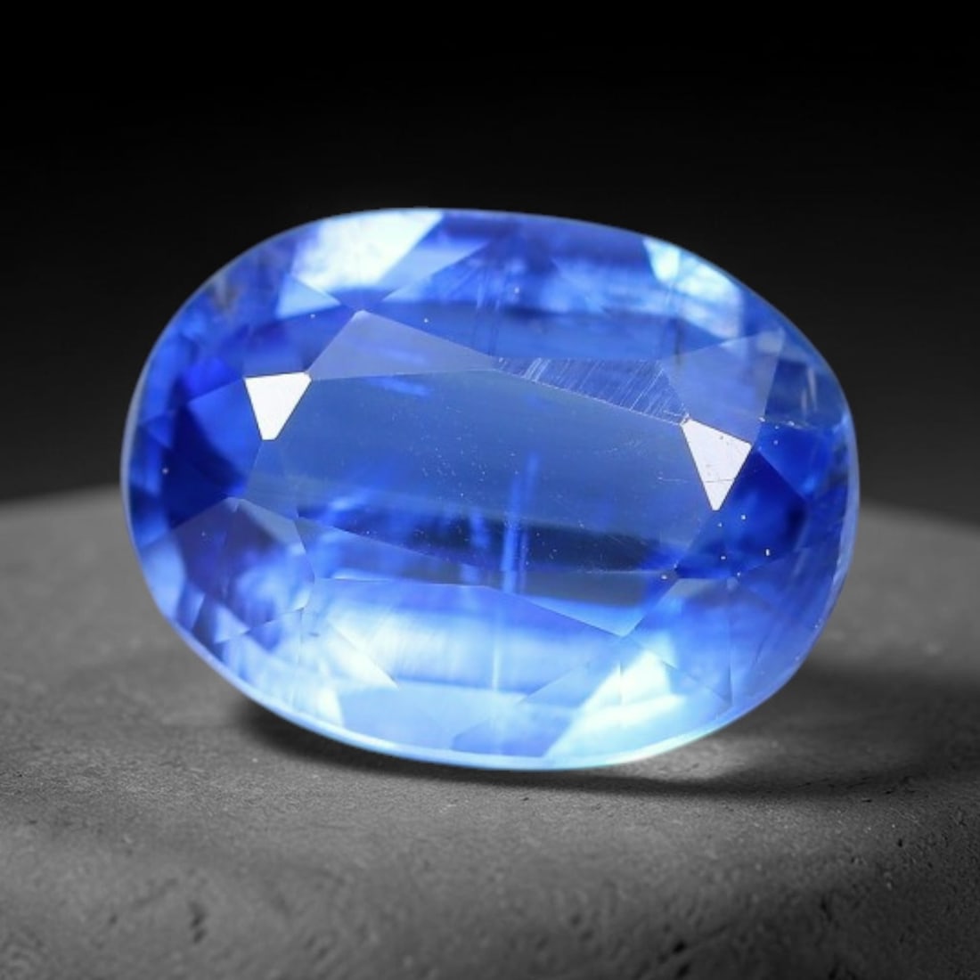 1.52 Carats Natural Brazilian Kyanite Oval Faceted Loose Gemstone, 57XY: This specimen consists of natural kyanite mineral material refined via professional faceted lapidary work, with uniform polished surfaces across the crystal exterior. Natural internal particulate mark