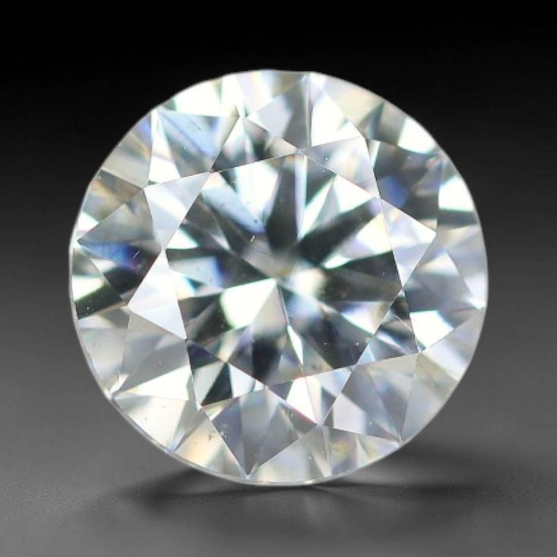 0.99 Carats Clear Moissanite Loose Gemstone, 38WP: This moissanite features dimensions of 6.4x4mm, a lab-created silicon carbide gemstone prized for its exceptional refractive index that generates brilliant light dispersion and consistent sparkle in a
