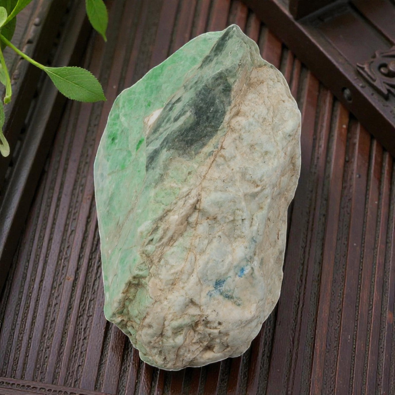 365Ct Natural Type A Burmese Jadeite Jade Rough Stone - Green Raw Material, 7ZB: Natural Type A Burmese jadeite rough stone, displaying vibrant green sections alongside natural weathered skin and darker mineral inclusions. The stone retains its uncut, raw form, showcasing natural 