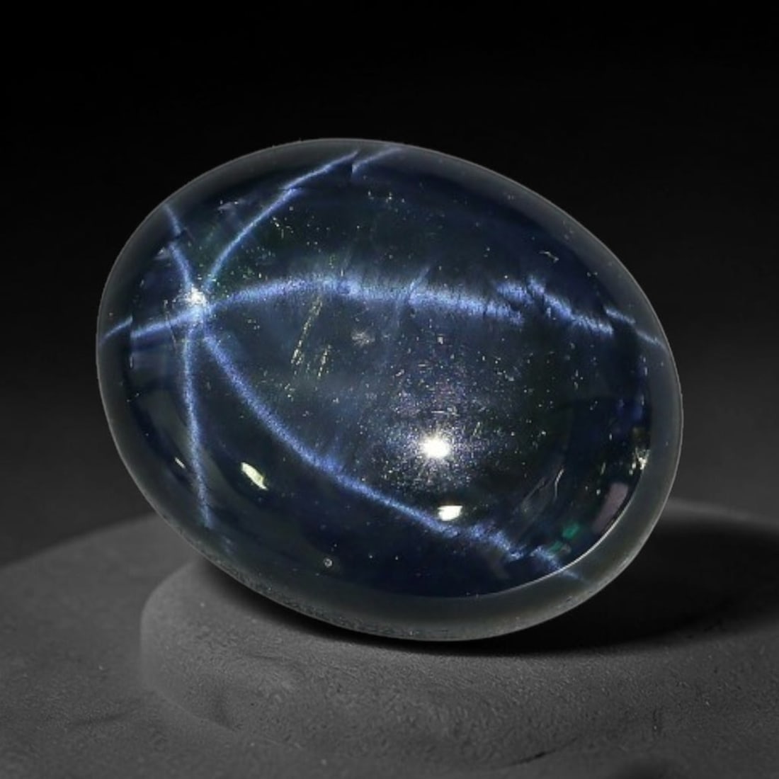 4.30 Carats Natural 6 Ray Blue Star Sapphire Loose Gemstone, 44XX: This star sapphire is crafted from natural corundum deposits and refined into a sleek polished cabochon form through professional lapidary finishing procedures. The distinct six-ray star asterism disp