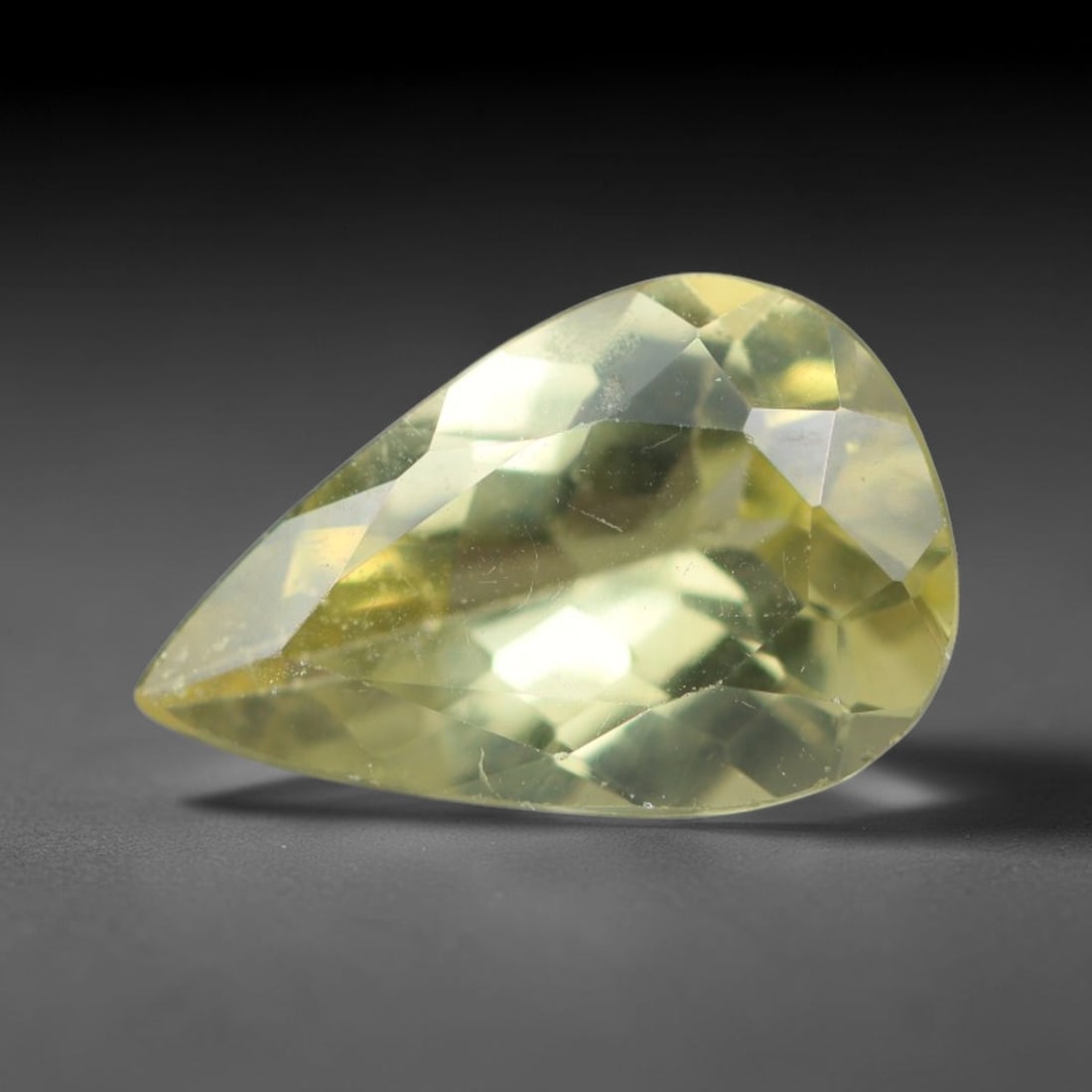 2.28 Carats Natural Pale Yellow Apatite Faceted Loose Gemstone, 42XY: This apatite specimen is sourced from natural geological deposits and shaped with professional faceting and high-gloss polishing work across the outer facet surfaces. Minute internal mineral inclusion