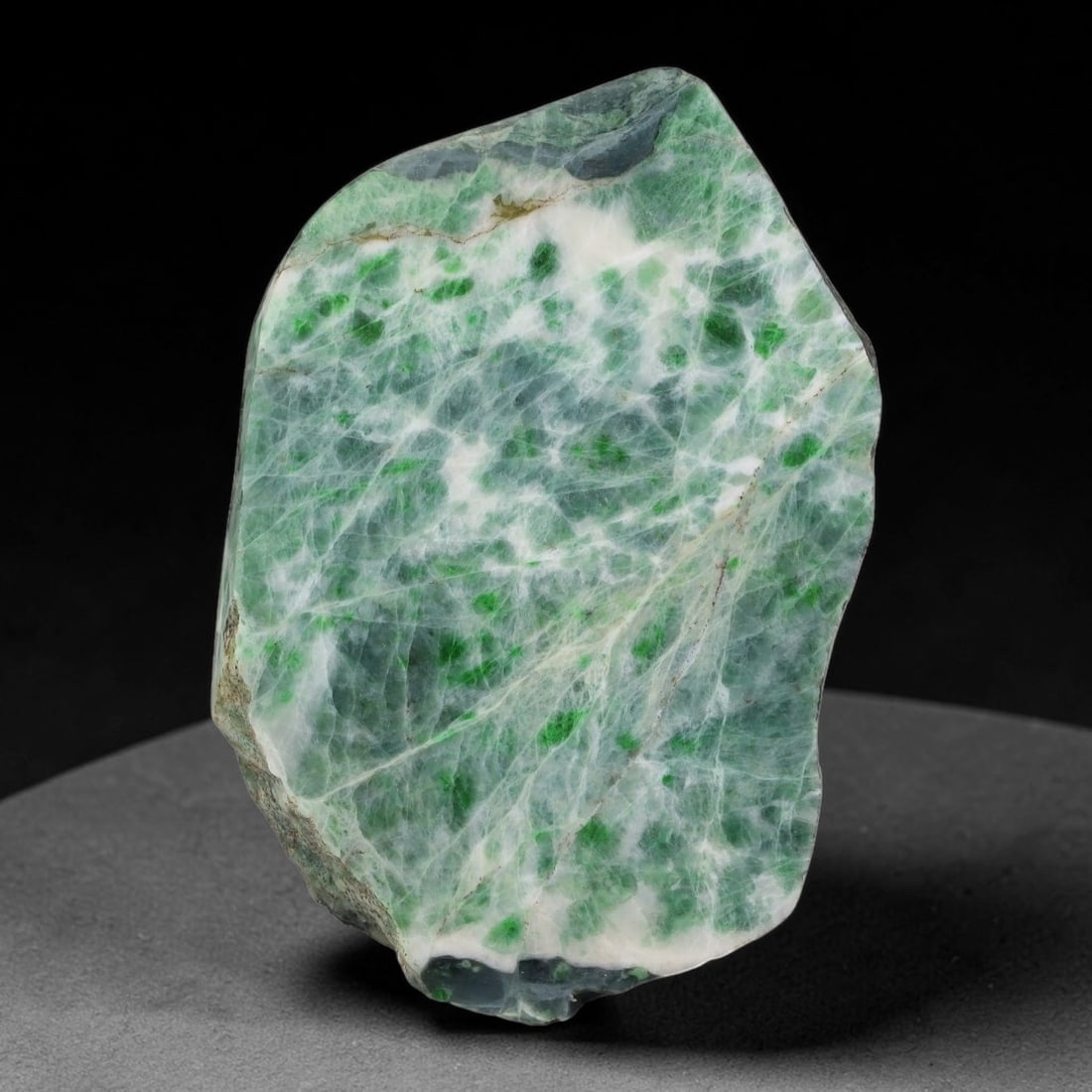 350ct Natural Type A Burmese Jadeite Jade Sliced Rough, 10YK: This specimen is a sliced rough block of natural Type A Burmese jadeite jade. The interior displays natural colour zoning with visible mineral veining and crystalline patterns typical of unprocessed j