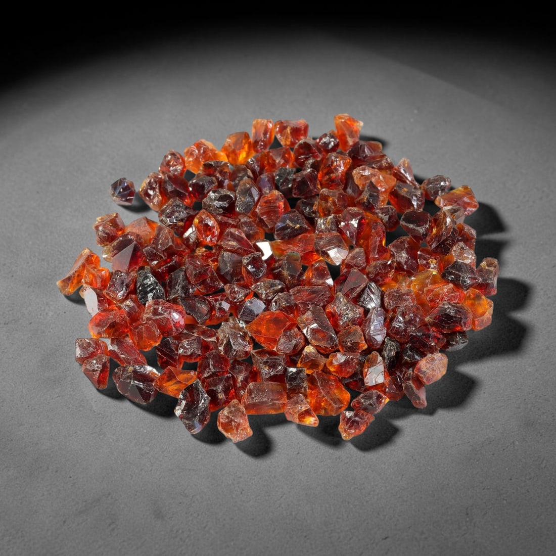 127.65 Carats Natural Garnet Rough Parcel, 74WV: This rich parcel of natural garnet rough displays deep saturated reddish-brown and fiery orange-red tones characteristic of almandine garnet, with natural translucent to semi-transparent crystalline s