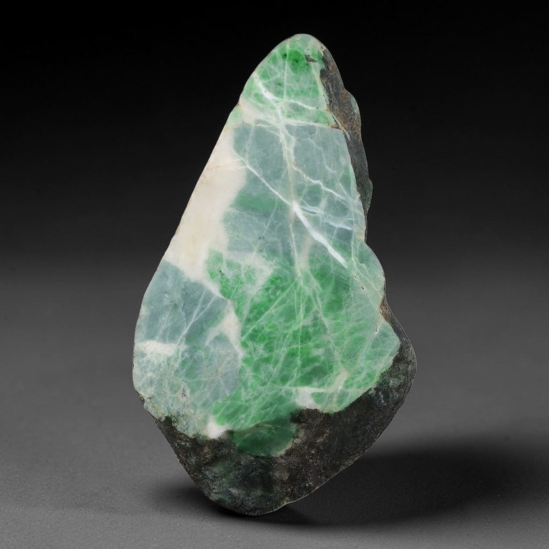315ct Natural Type A Burmese Jadeite Jade Sliced Rough, 4YK: This specimen is a sliced rough block of natural Type A Burmese jadeite jade. The interior displays natural colour zoning with visible mineral veining and crystalline patterns typical of unprocessed j