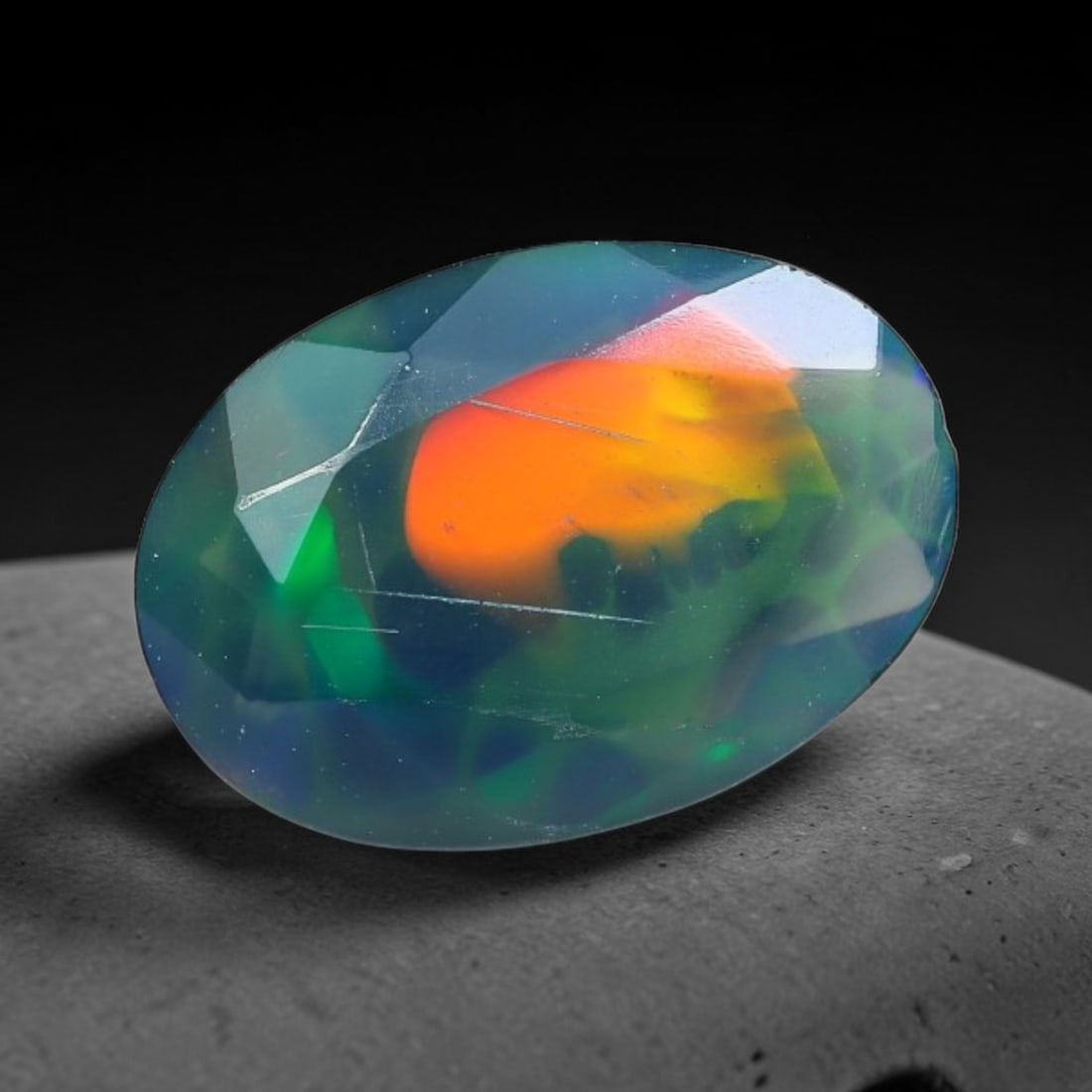 1.13 Carats Natural Ethiopian Welo Black Opal Oval Faceted Loose Gemstone, 69XX: This opal is mined from the Welo region of Ethiopia and expertly faceted and polished into an oval shape by professional lapidary techniques. Natural fine internal particles and faint natural fissures