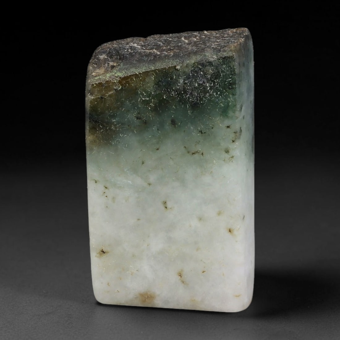 200ct Natural Type A Burmese Jadeite Jade Sliced Rough, 53YR: This specimen is a sliced rough block of natural Type A Burmese jadeite jade. The interior displays natural colour zoning with visible mineral veining and crystalline patterns typical of unprocessed j