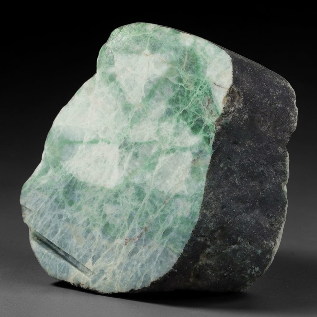 255ct Natural Type A Burmese Jadeite Jade Sliced Rough, 96YN: This specimen is a sliced rough block of natural Type A Burmese jadeite jade. The interior displays natural colour zoning with visible mineral veining and crystalline patterns typical of unprocessed j