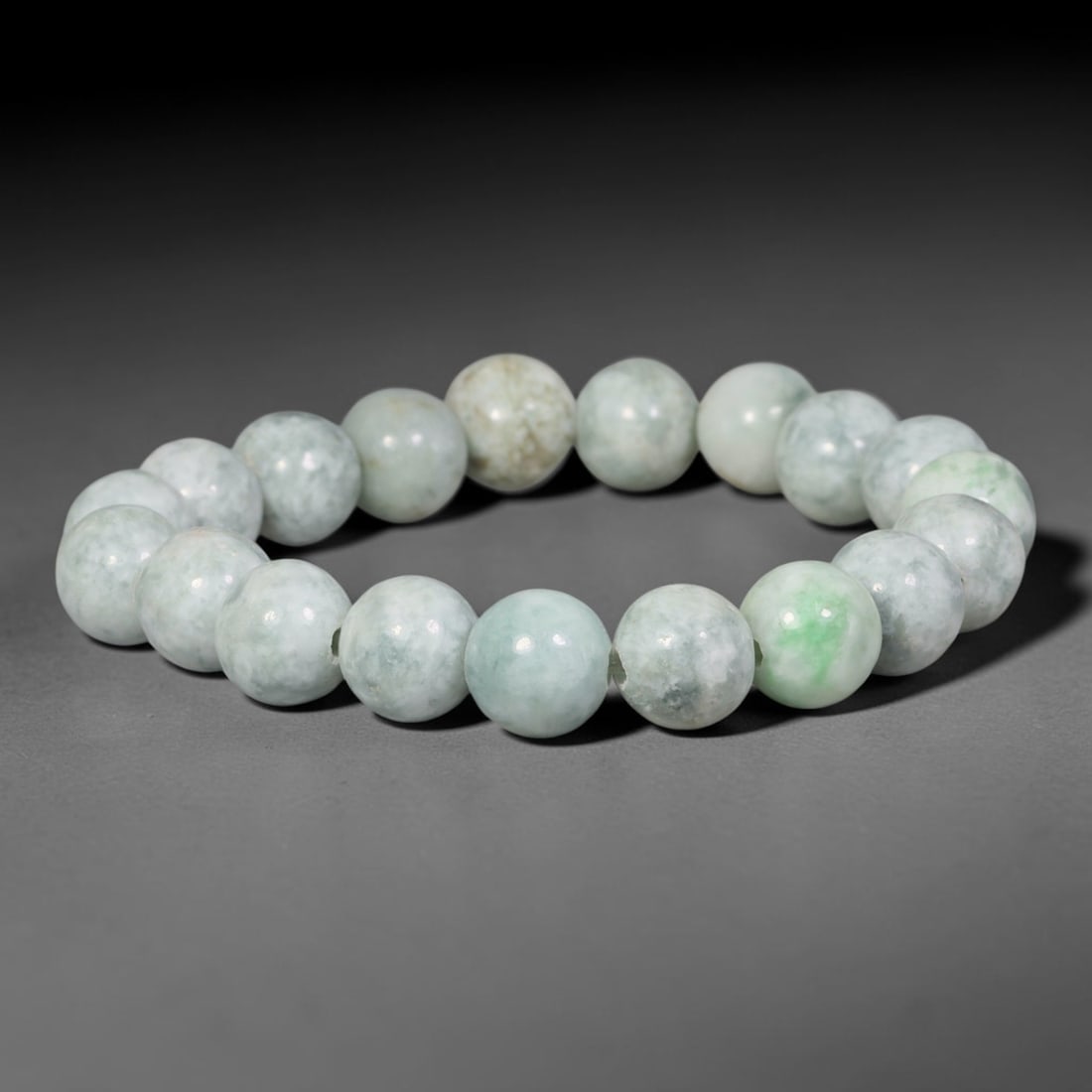 Natural Burmese Type A Pale Celadon Floating Green Jadeite Jade Beaded Bracelet, 91TA: Made of 100% untreated genuine Burmese Type A jadeite, this bracelet consists of evenly polished medium round beads with a soft pale celadon base scattered with bright natural floating green spots and