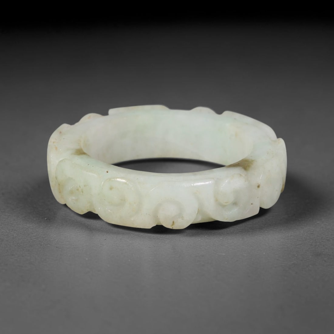 Natural Burmese Type A Jadeite Jade Carving Band Ring Size US 11, 13TB: Carved from untreated natural Burmese Type A jadeite jade, this carved stone band holds a soft polished finish showcasing milky pale base hues interspersed with warm natural brown mineral patina patch