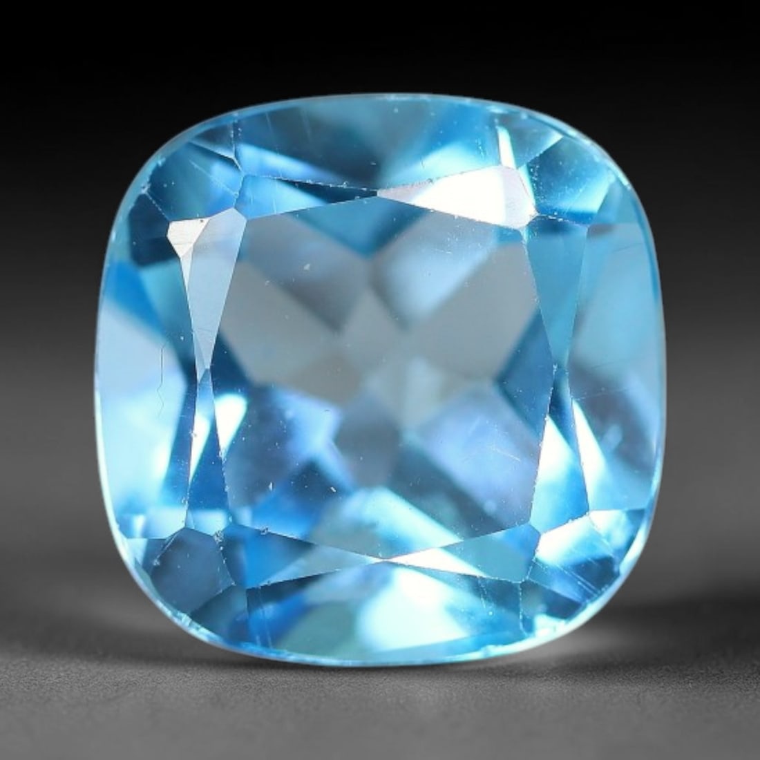 3.63 Carats Natural Swiss Blue Topaz Loose Gemstone, 15WP: This genuine natural swiss blue topaz displays consistent saturated blue coloration inherent to unprocessed natural mineral specimens. Formed through natural geological formation, the stone carries su