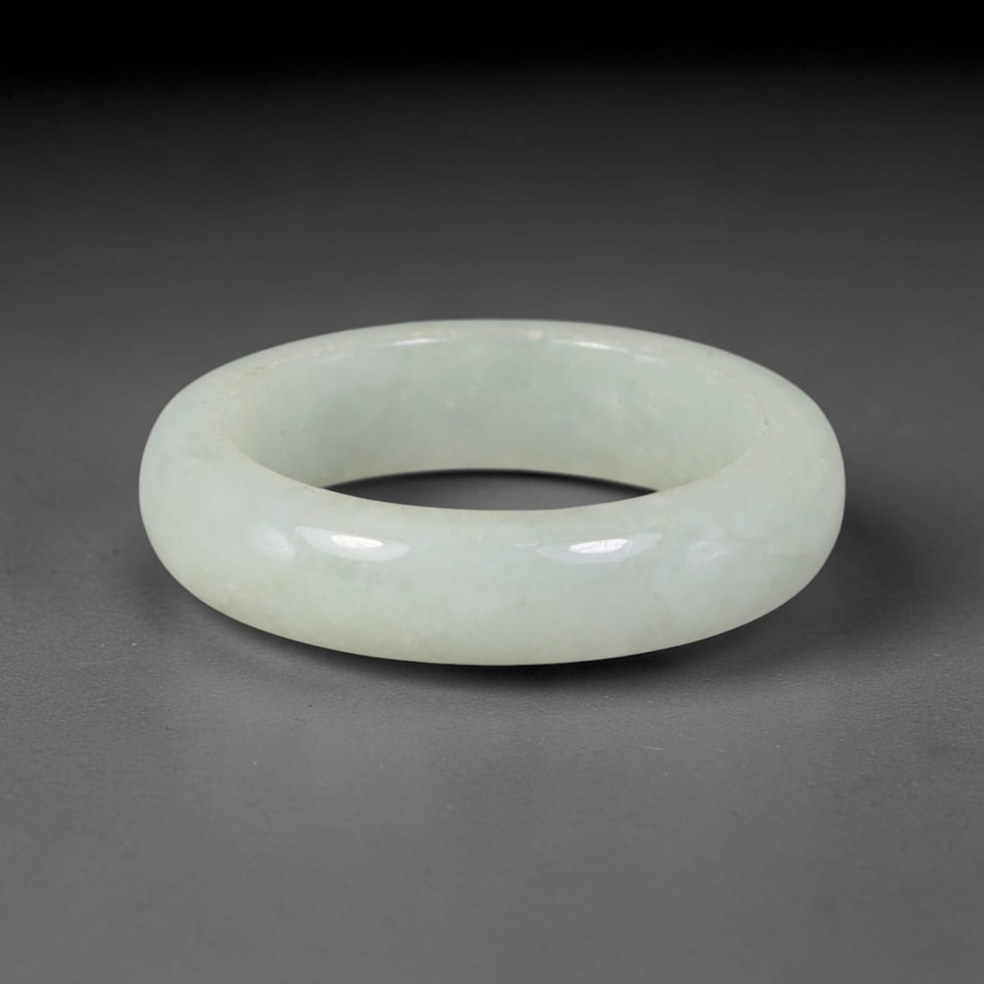 Natural Burmese Type A Jadeite Jade Band Ring Size US 12, 30TB: Crafted from untreated natural Burmese Type A jadeite jade, this solid stone band features a high-gloss polished finish displaying consistent deep green mineral tones interwoven with natural subtle to