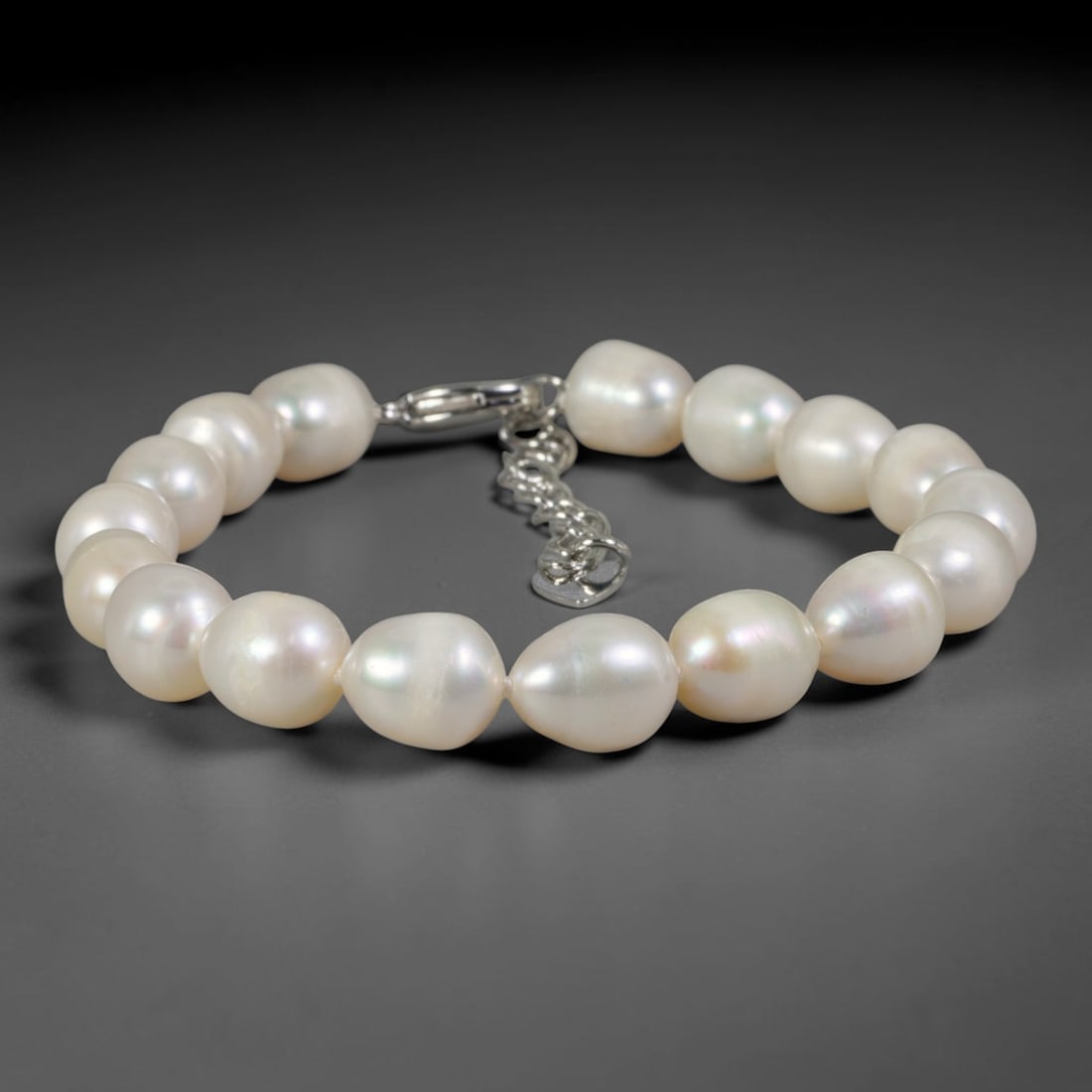 Natural Freshwater Pearl Bracelet - Baroque Luminous White Pearl Strand, 92YM: Composed of smooth organic baroque natural freshwater pearls with uniform luminous white pearlescent luster, each bead bearing soft asymmetrical oval contours formed through natural freshwater pearl c