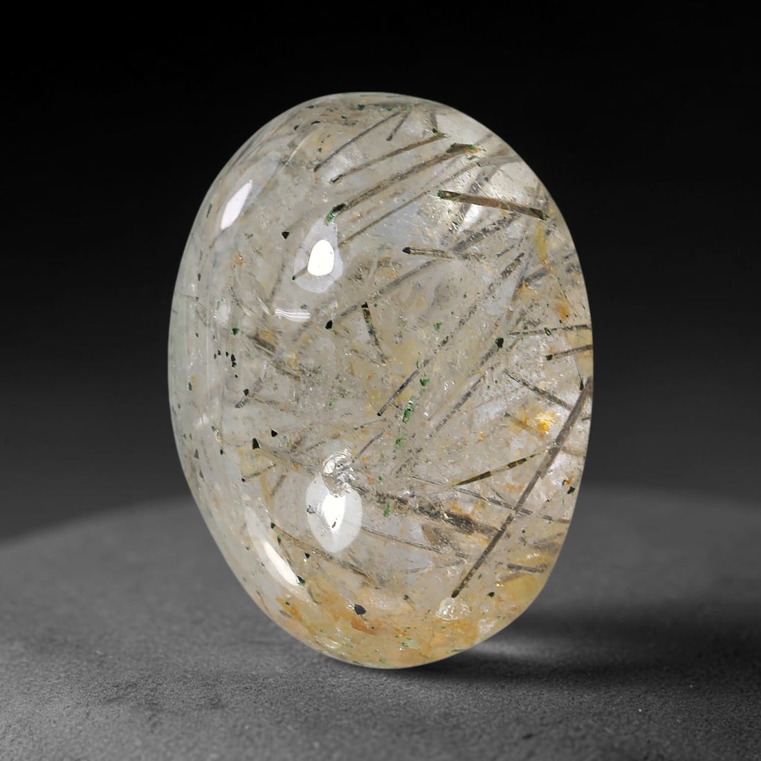 24.80ct Natural Brazilian Black Rutile Quartz Cabochon Loose Gemstone, 12YX: This polished cabochon of natural rutile quartz features countless distinct slender black rutile needle inclusions suspended within the clear quartz host crystal. The smooth domed surface enables full