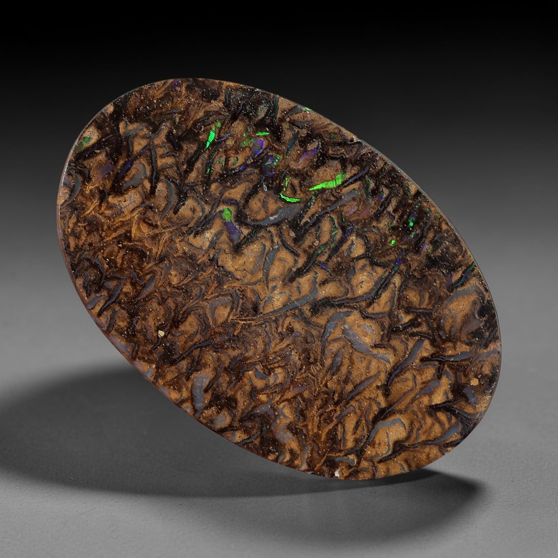 2.52 Carats Koroit Boulder Opal Cabochon - Natural Australian Stones 12.7x8.3mm, 6XM: This striking 2.52-carat Koroit boulder opal cabochon is a natural geological masterpiece, featuring a dense, intricate matrix of swirling chocolate-brown ironstone, interwoven with vivid veins of iri