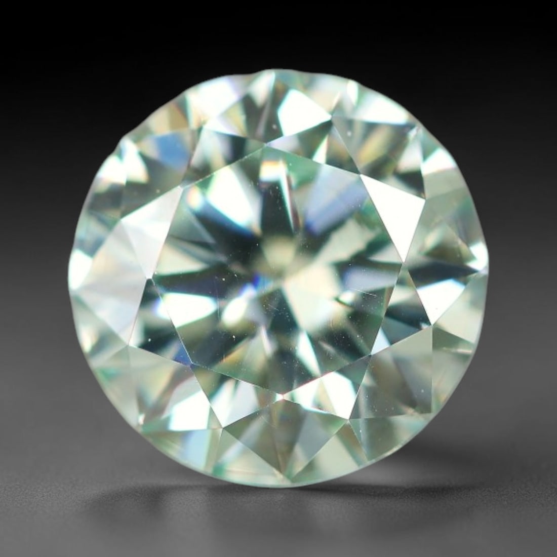 0.96 Carats Aqua Toned Moissanite Loose Gemstone, 66WP: This moissanite features dimensional measurements of 6.4x3.9mm, lab-grown silicon carbide material valued for superior light refraction that delivers vivid multi-hued sparkle across all lighting condi