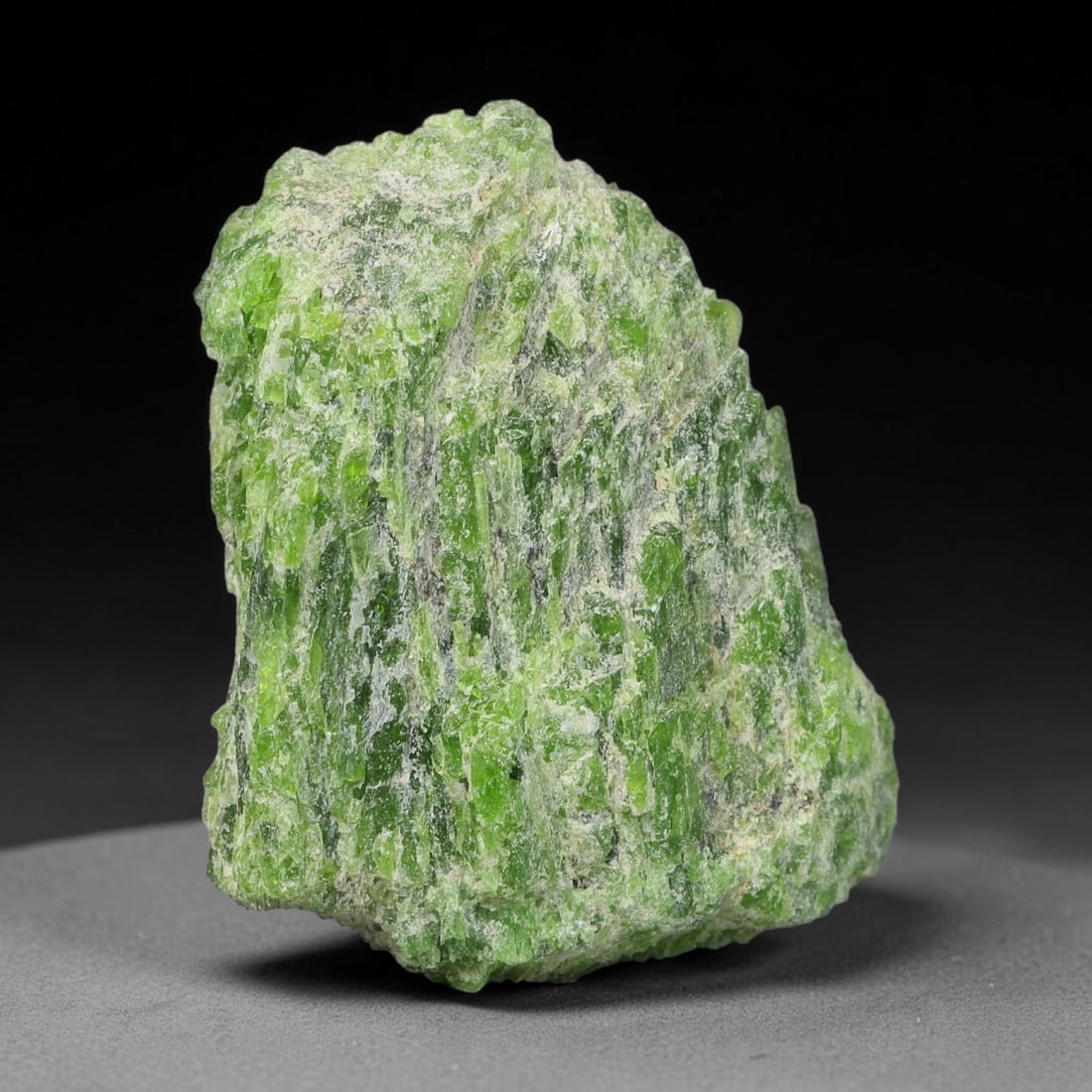 59 Carats Natural Vibrant Green Chrome Diopside Rough Specimen, 28YS: This is an untreated natural chrome diopside mineral specimen formed through natural geological processes, displaying rich green coloration caused by chromium content within its crystalline structure.
