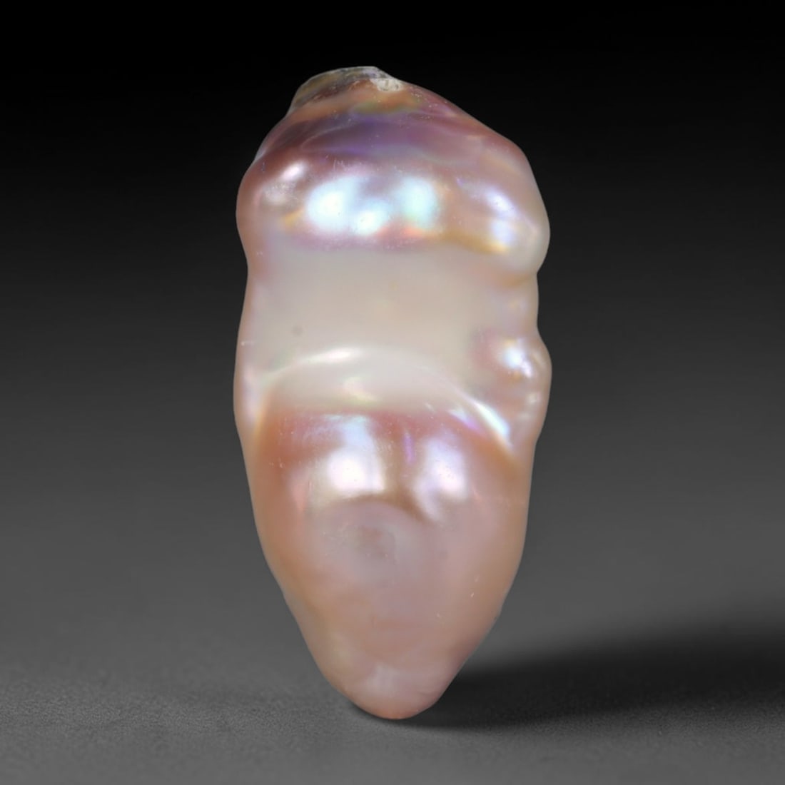 Natural Freshwater Keshi Pearl Baroque Loose Pearl, 82WE: This natural freshwater keshi pearl features an organic irregular baroque form with soft iridescent luster shifting across pale lavender, peach and champagne overtones. The nacre surface bears natural