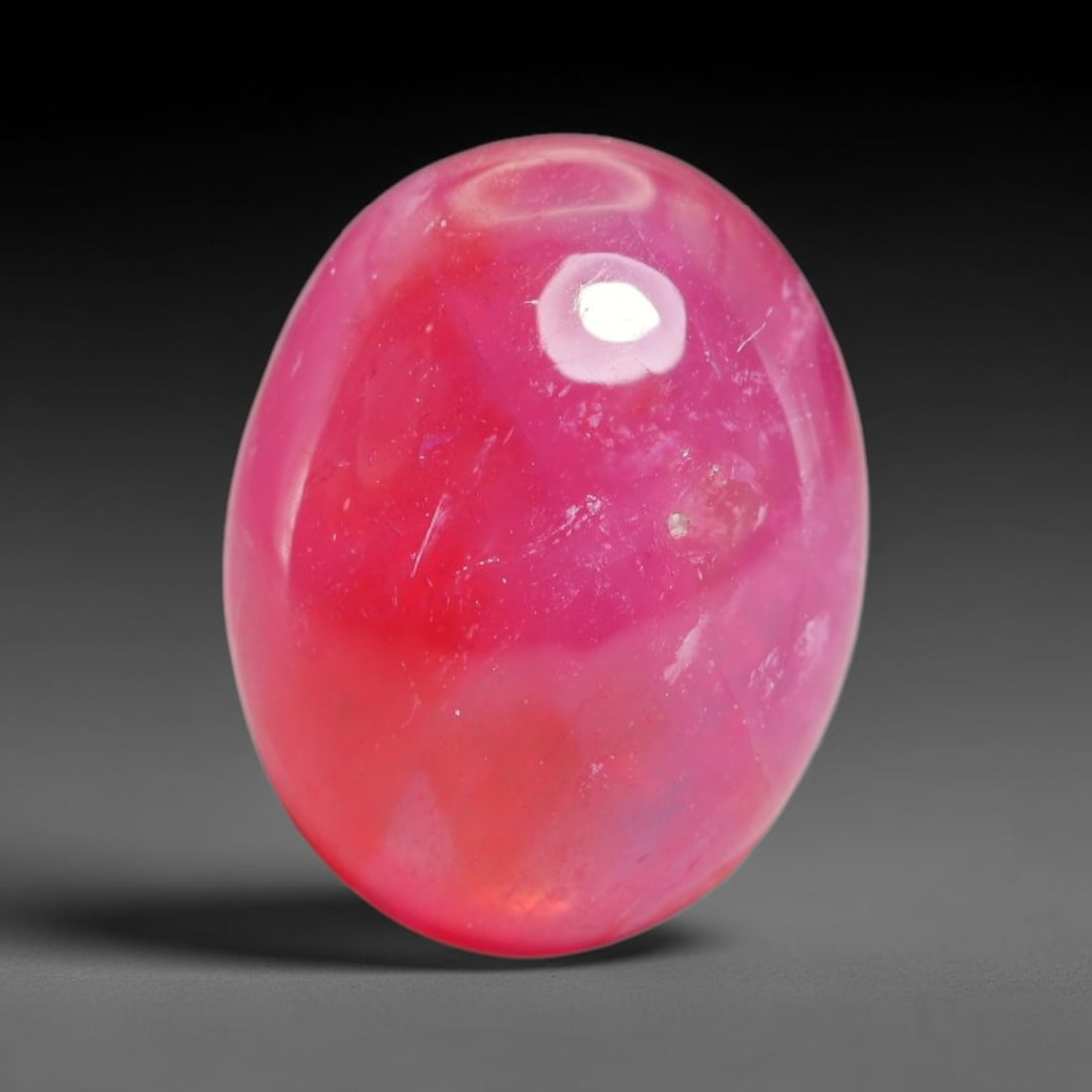 11.69 Carats Natural Mozambique Ruby Cabochon Loose Gemstone, 18XX: This ruby originates from Mozambique natural mineral deposits and receives professional cabochon grinding and polishing treatment to form a smooth glossy exterior surface. Tiny mineral particles and n
