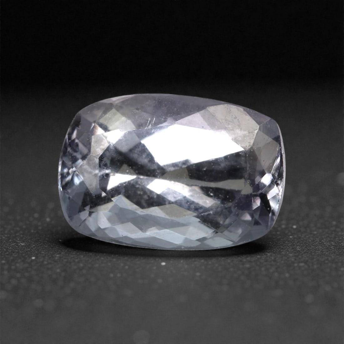 2.08 Carats Violet Blue Tanzanian Tanzanite Cushion Cut , 52XK: This refined tanzanite displays a soft violet blue body color with subtle shifts between lavender and steel blue as light moves across its surface. The cushion cut enhances the stone's gentle brillian