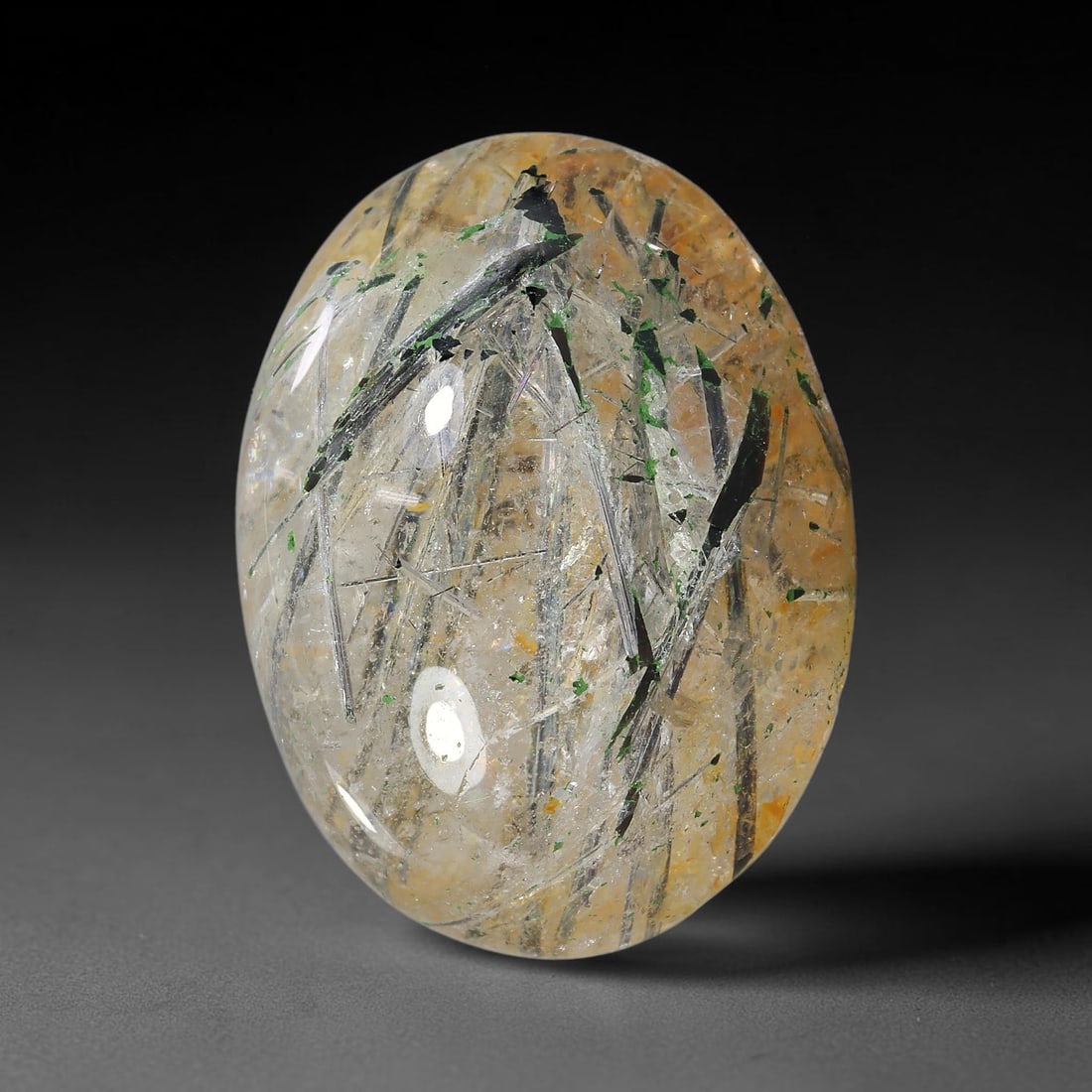 34.88ct Natural Brazilian Black Rutile Quartz Cabochon Loose Gemstone, 11YX: This polished cabochon of natural rutile quartz features countless distinct slender black rutile needle inclusions suspended within the clear quartz host crystal. The smooth domed surface enables full