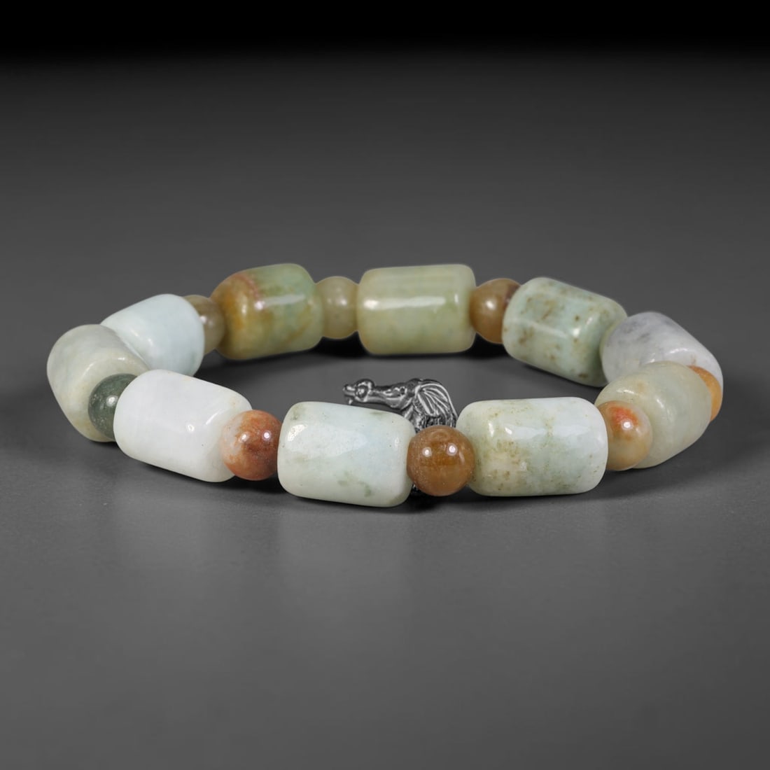 Natural Burmese Type A Multi-Tone Jadeite Jade Barrel Beaded Bracelet, 9TA: Crafted from untreated natural Burmese Type A jadeite jade beads with maximum bead dimension of 10.95mm, this wearable strand features a gentle polished finish displaying layered natural earthy minera