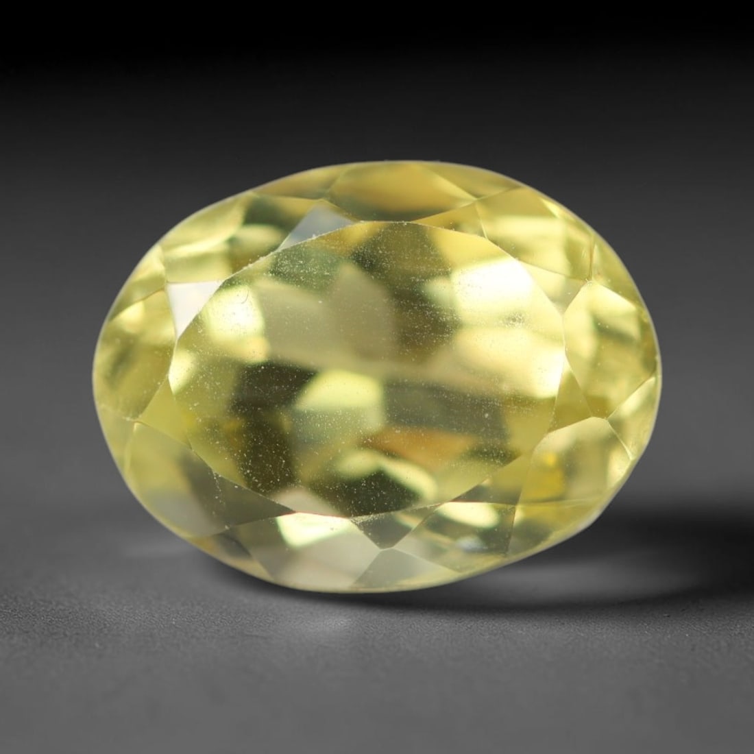 5.56 Carats Natural Brazilian Lemon Quartz Oval Faceted Loose Gemstone, 3XX: This lemon quartz is sourced from natural mineral deposits within Brazil and refined through standard professional faceted lapidary procedures, accompanied by uniform glossy polishing across the full 