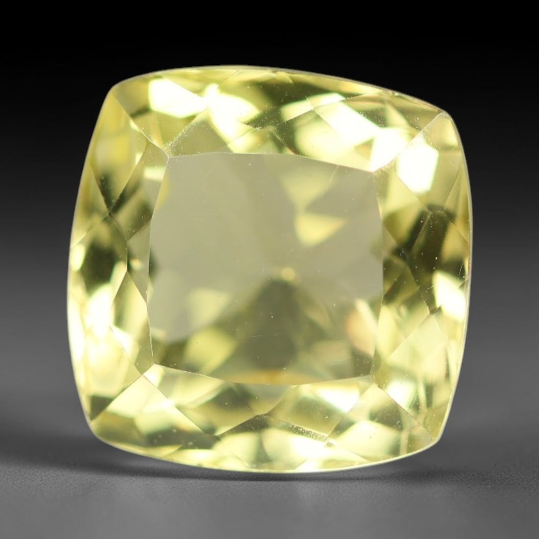8.81 Carats Natural Brazilian Lemon Quartz Cushion Faceted Loose Gemstone, 5XX: This lemon quartz is sourced from natural mineral deposits within Brazil and refined through standard professional faceted lapidary procedures, accompanied by uniform glossy polishing across the full 