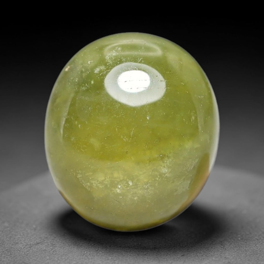 5.29 Carats Natural Madagascar Greenish Yellow Sapphire Cabochon Loose Gemstone, 38XX: Formed from natural corundum sourced from Madagascar geological deposits, this raw mineral material is processed into a polished cabochon form through professional stone finishing techniques with a sm