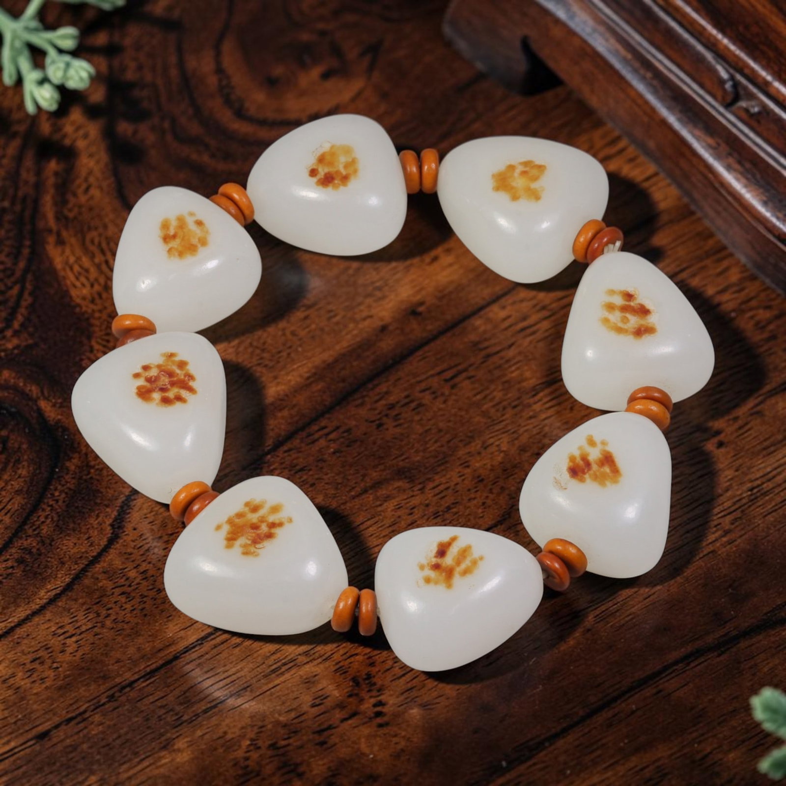Chinese Hetian Nephrite White Seed Pebble Bracelet - Natural Russet Skin, 53YJ: This bracelet is strung from natural, uncarved Hetian nephrite white seed pebble jade stones, each retaining organic river-worn, rounded triangular forms with a soft milky white base tone. Each stone 