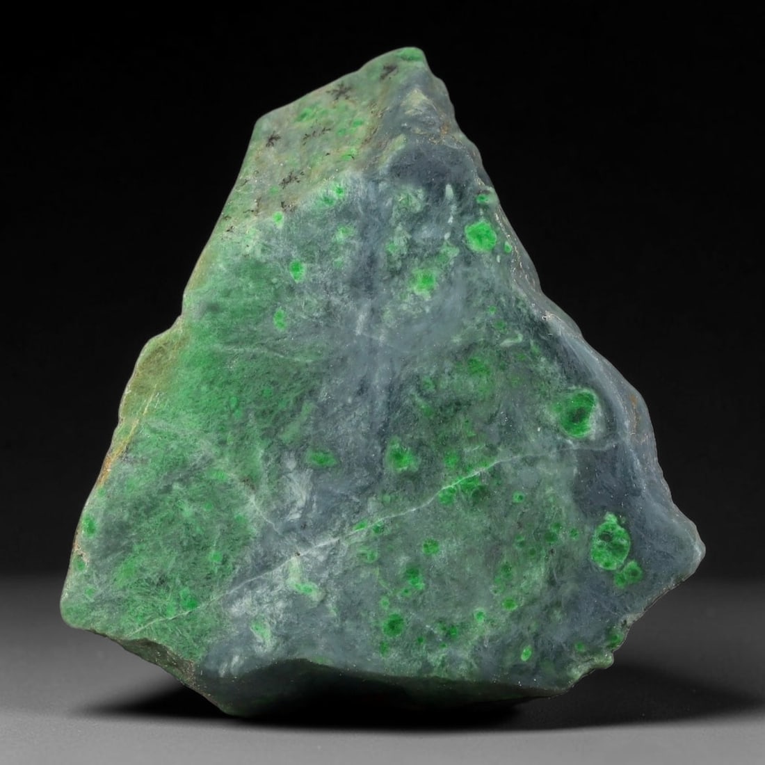 132ct Natural Type A Burmese Jadeite Jade Sliced Rough, 76YN: This specimen is a sliced rough block of natural Type A Burmese jadeite jade. The interior displays natural colour zoning with visible mineral veining and crystalline patterns typical of unprocessed j