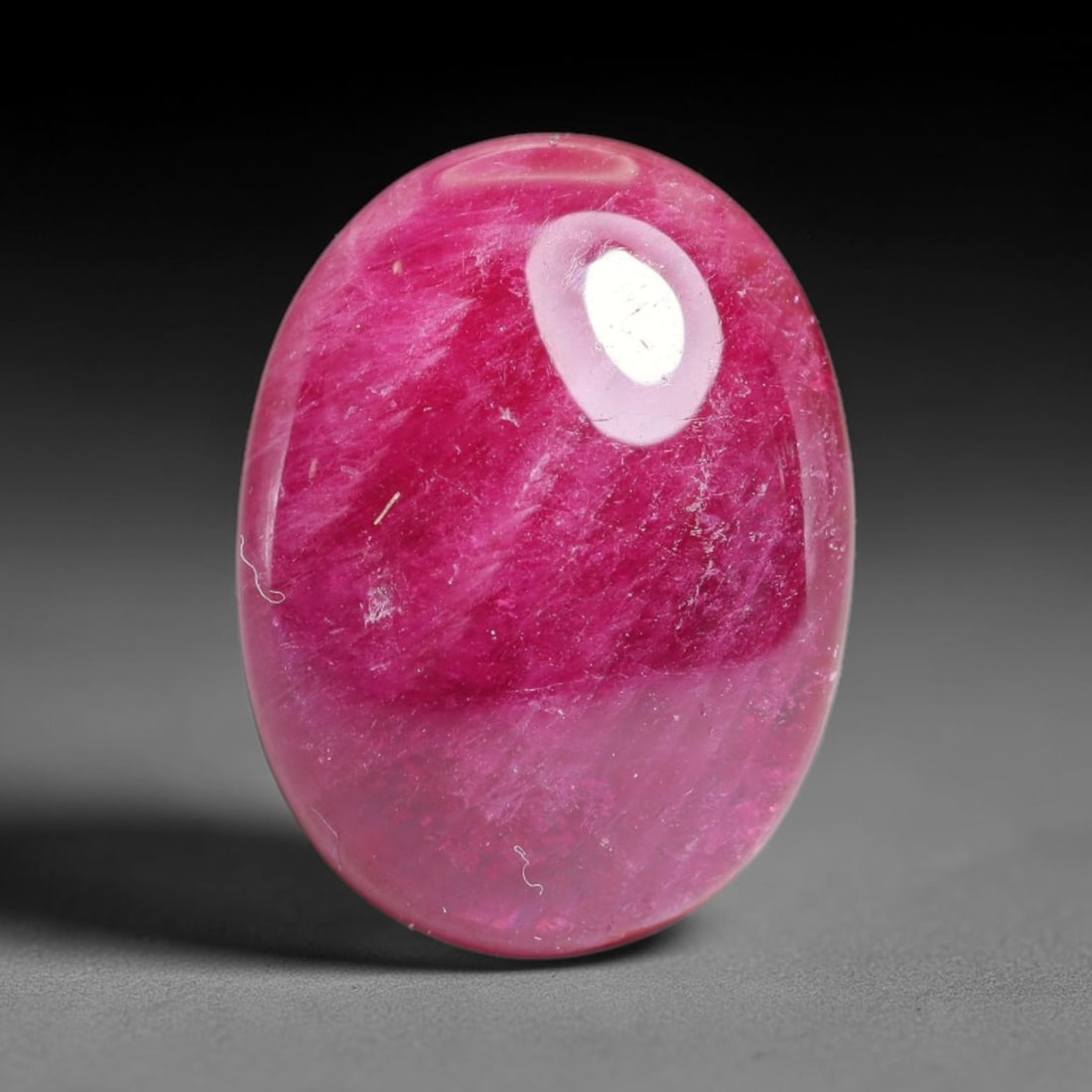 15.13 Carats Natural Mozambique Ruby Cabochon Loose Gemstone, 22XX: This ruby originates from Mozambique natural mineral deposits and receives professional cabochon grinding and polishing treatment to form a smooth glossy exterior surface. Tiny mineral particles and n