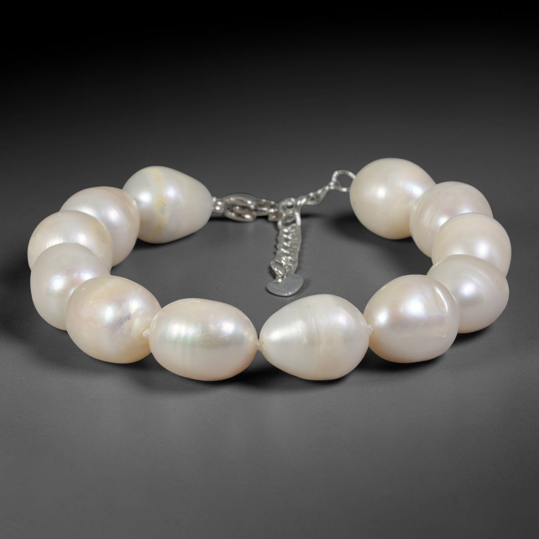 Natural Freshwater Pearl Bracelet - Oversized Baroque Pearl Strand, 85YM: Composed of large organic baroque natural freshwater pearls bearing soft pearlescent iridescence, each bead featuring substantial asymmetrical oval and teardrop contours inherent to natural freshwater