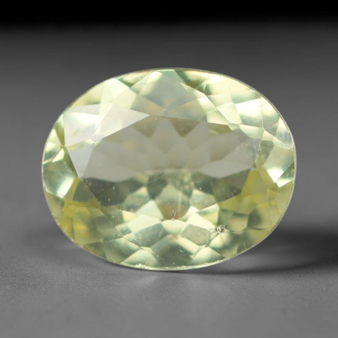 1.73 Carats Natural Pale Yellow Apatite Faceted Loose Gemstone, 46XY: This apatite specimen is sourced from natural geological deposits and shaped with professional faceting and high-gloss polishing work across the outer facet surfaces. Minute internal mineral inclusion