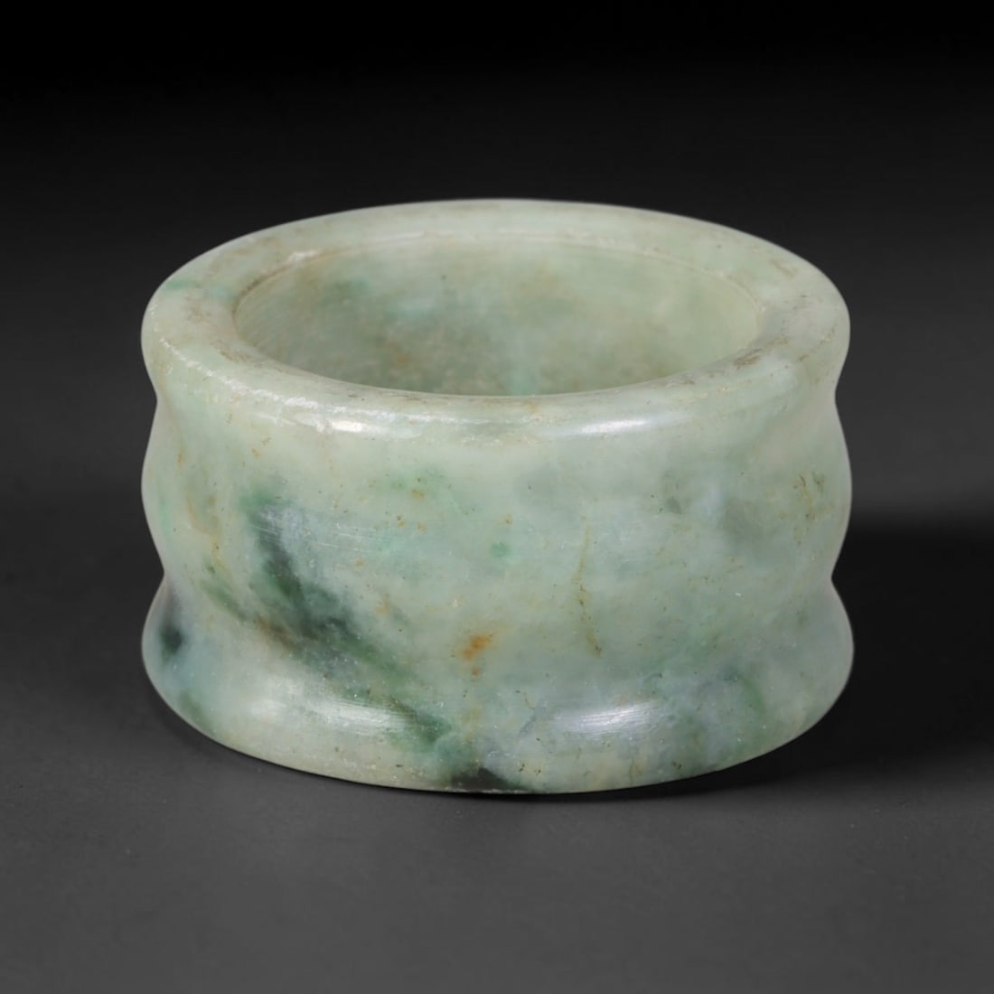 Natural Burmese Type A Jadeite Jade Band Ring Size US 9.50, 1TB: Fashioned from untreated natural Burmese Type A jadeite jade, this solid stone band carries a smooth polished finish showcasing milky pale base tones blended with soft natural green mineral undertones
