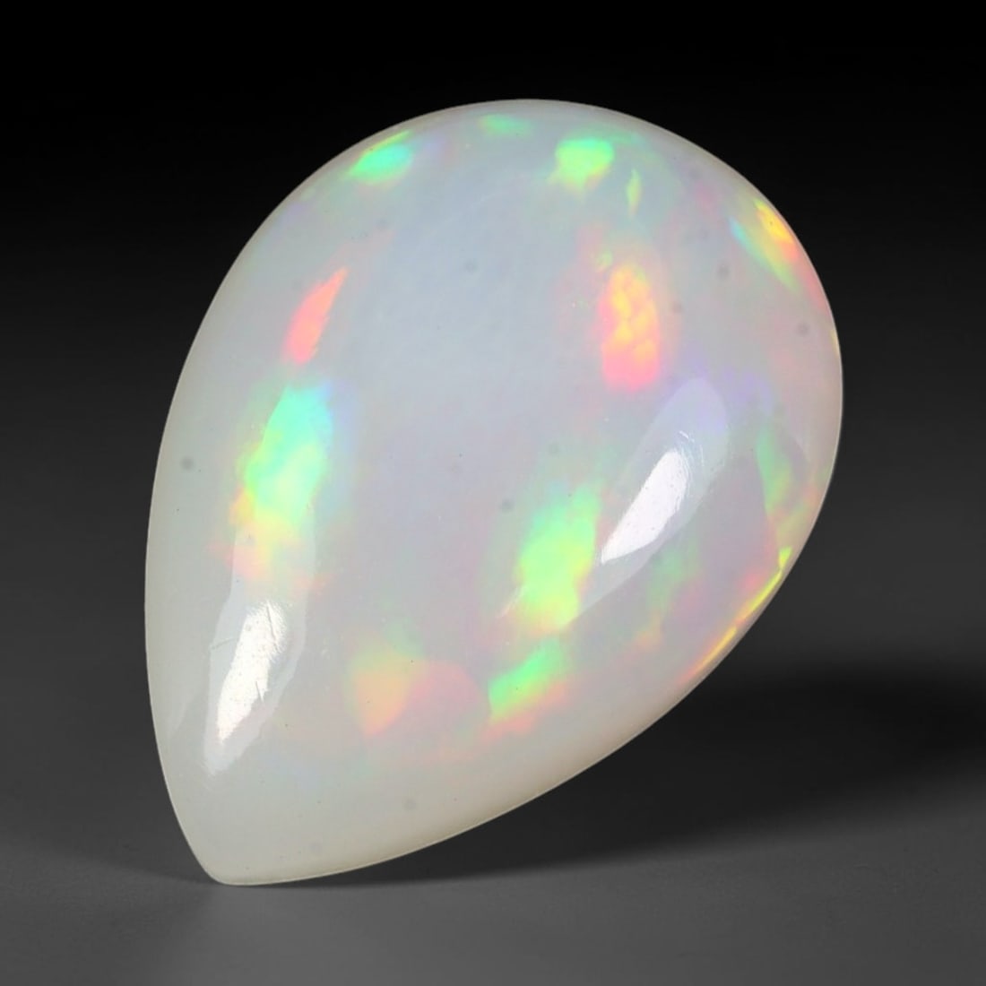 7.28ct Natural Multicolor Fire Ethiopian Welo Solid Opal Cabochon Loose Gemstone, 15TG: Formed from natural silica deposits within Ethiopian mineral veins, this solid opal cabochon is expertly polished to a smooth domed surface that fully showcases inherent light refraction properties. T