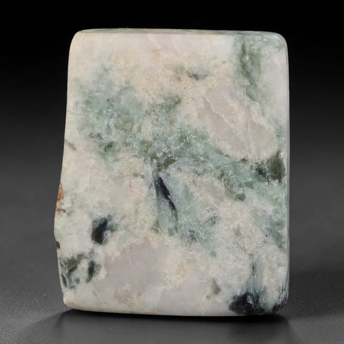 250ct Natural Type A Burmese Jadeite Jade Sliced Rough, 36YR: This specimen is a sliced rough block of natural Type A Burmese jadeite jade. The interior displays natural colour zoning with visible mineral veining and crystalline patterns typical of unprocessed j
