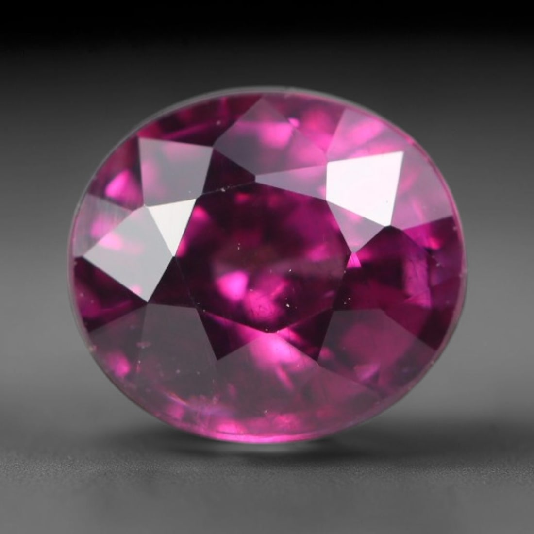 1.74 Carats Natural Rich Magenta Red Garnet Oval Faceted Loose Gemstone, 48WW: This garnet originates from natural geological mineral deposits and undergoes precise faceting and high-gloss reflective polishing via professional lapidary craftsmanship. Minute pinpoint mineral spec