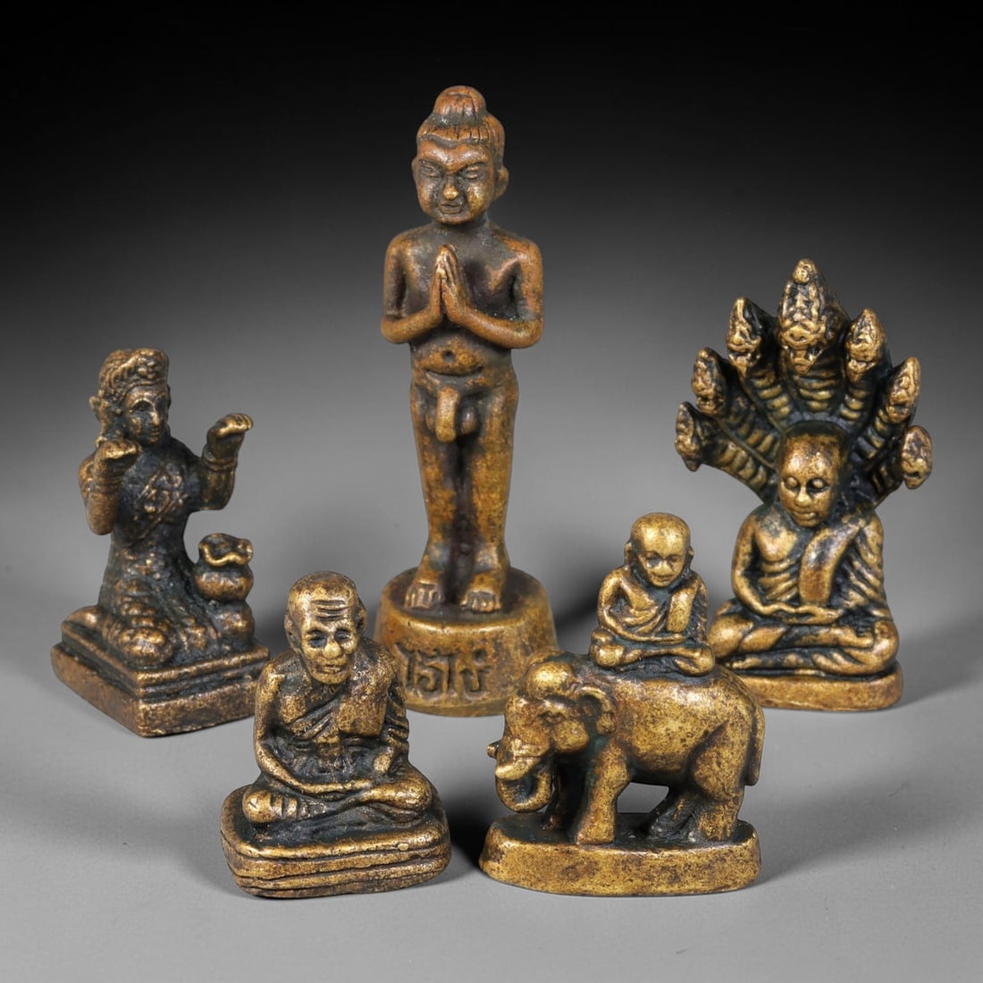 Thai Vintage Copper Alloy Mixed Buddhist Mini Amulet Statues - 5pcs Set, 11YZ: Vintage Thai copper alloy miniature Buddhist figurine set with five unique pieces, each measuring 5.5x1.5cm. The assortment includes a kneeling offering deity, standing newborn Buddha with prayer hand