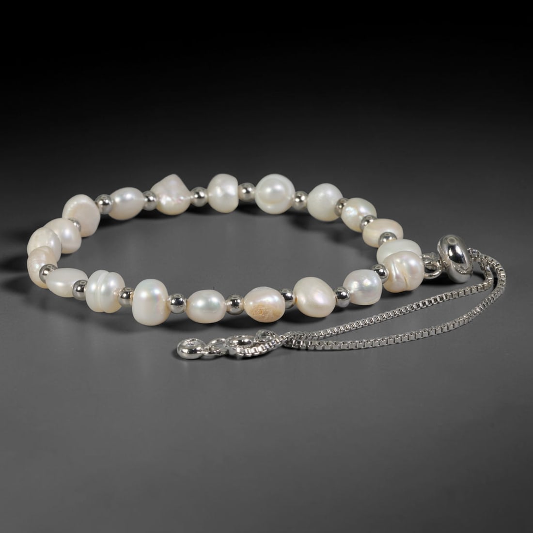 Natural Freshwater Pearl Bracelet - Baroque Cream Pearl Strand, 97YM: Strung from organic baroque natural freshwater pearls with soft creamy white iridescence, each bead featuring unique asymmetrical shapes typical of naturally cultivated freshwater pearls. Subtle faint