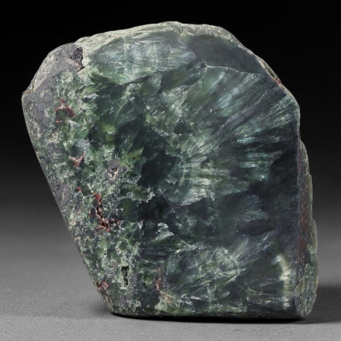 107ct Natural Siberian Seraphinite Polished Rough Slab, 29WV: This polished mineral slab is natural seraphinite originating from Siberian deposits, displaying characteristic radiating crystalline fibrous formations with layered deep forest and silvery green band