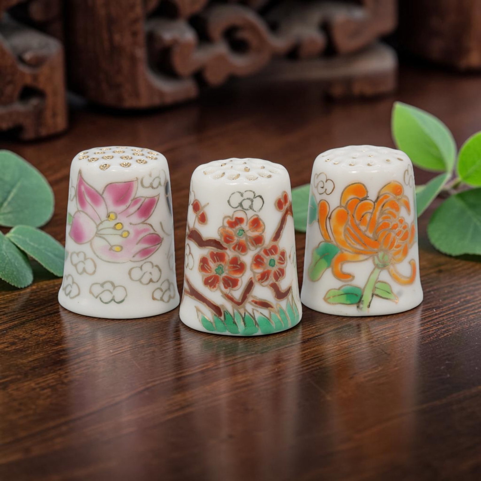 Vintage Hand-Painted Porcelain Floral Thimble Set of 3 - Mini Sewing Collectibles, 30YF: Crafted from fine white porcelain with delicate hand-painted floral motifs and gilded accents, this charming set of three vintage thimbles showcases three distinct flower designs: a soft pink lotus, a