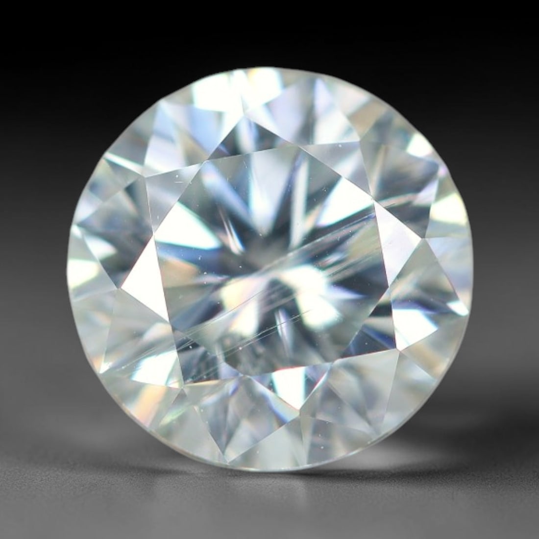 0.99 Carats Aqua Toned Moissanite Loose Gemstone, 69WP: This moissanite features dimensional measurements of 6.5x4mm, lab-grown silicon carbide material valued for superior light refraction that delivers vivid multi-hued sparkle across all lighting conditi