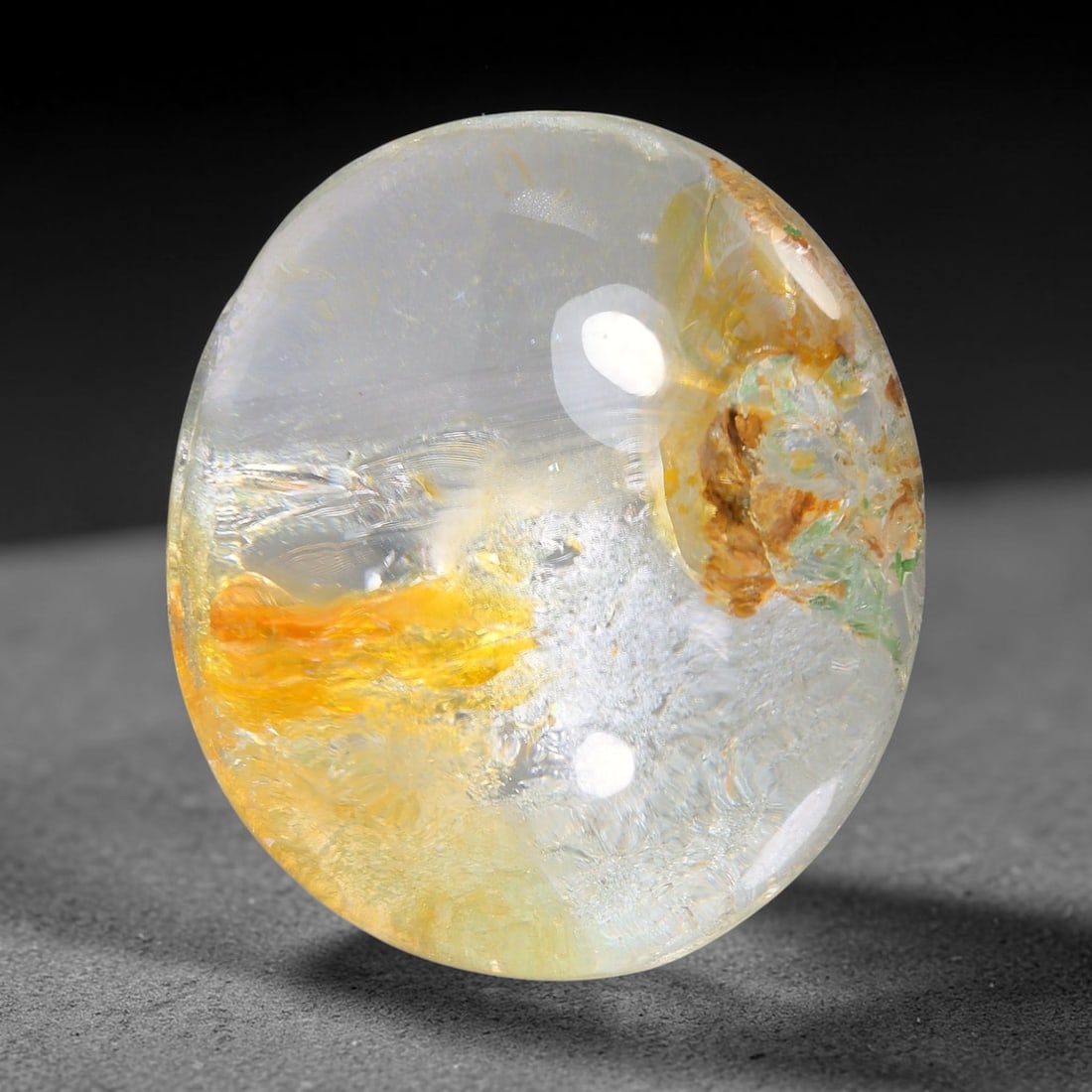 23.89ct Natural Brazilian Phantom Quartz Oval Cabochon Loose Gemstone, 42YX: This smoothly polished cabochon of natural phantom quartz preserves delicate layered phantom crystal formations enclosed inside transparent quartz host. The domed polished surface offers unobstructed 