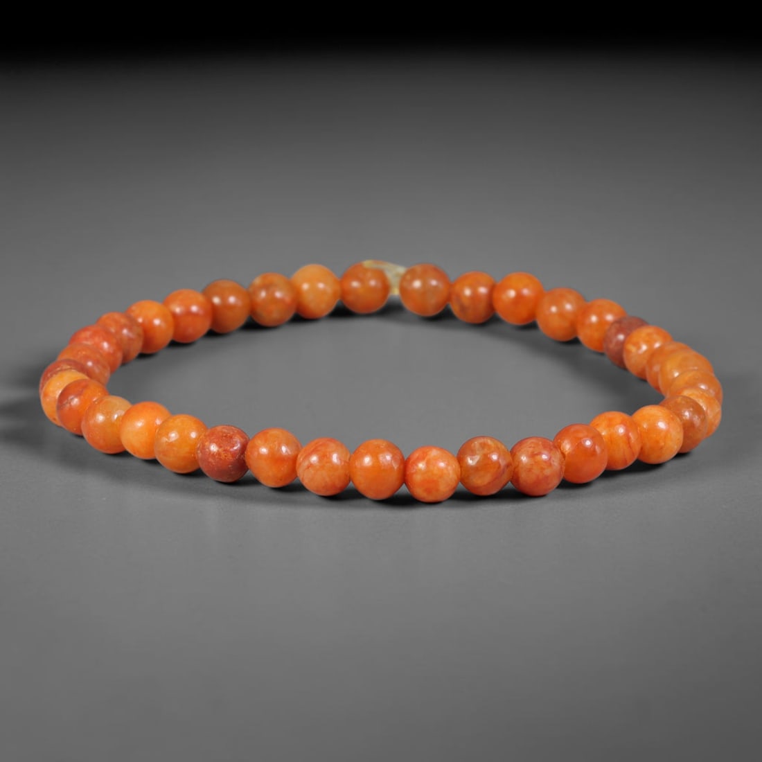 Natural Burmese Type A Full Orange Red Jadeite Jade Beaded Bracelet, 33TA: Crafted from untreated natural Burmese Type A jadeite jade beads measuring 5.7mm, this slim single-loop bracelet features uniformly polished round beads showcasing rich warm orange-red natural tones w